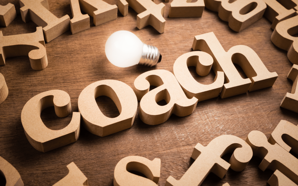 image du mot coach en lettre en bois